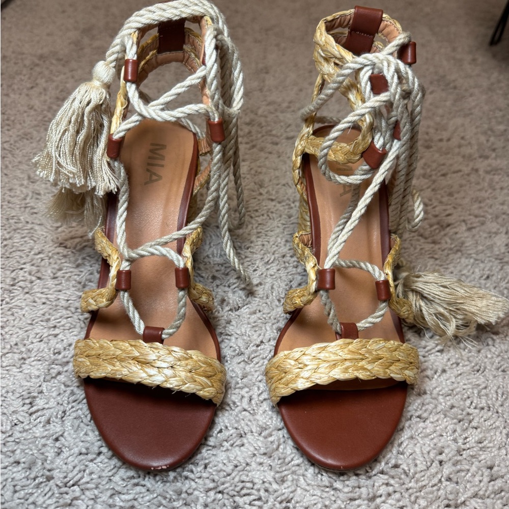Heels with wrap around ankle feature